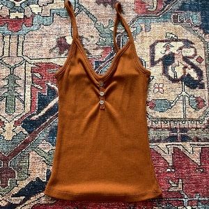Dark orange cropped tank top.
